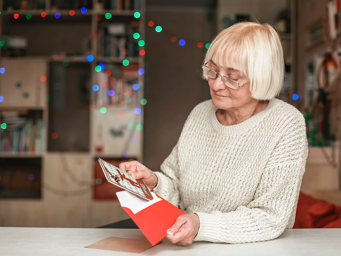 Woman Opening Personalised Christmas Card